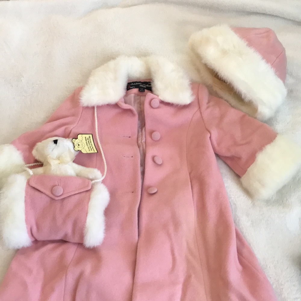 Pink dress coat with faux fur trim.
